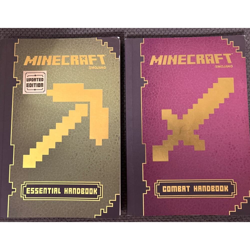 Lot of 2 Minecraft Handbooks Mojang Essential Updated Edition & Combat Edition